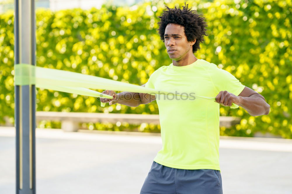 Similar – Black man running and listening to music in urban background