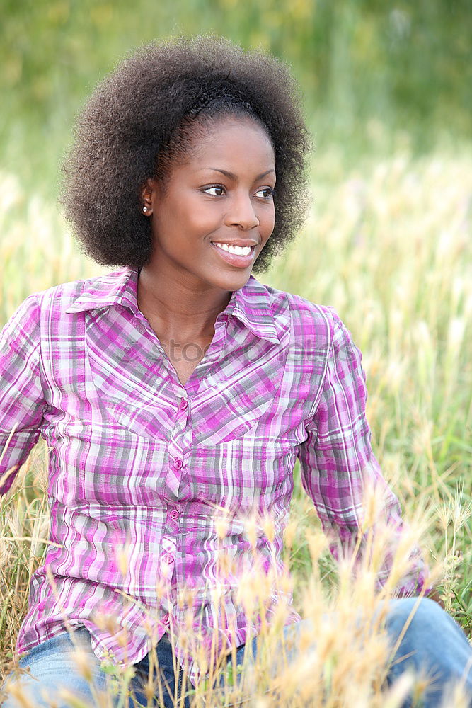 Similar – Young African American woman lying on grass