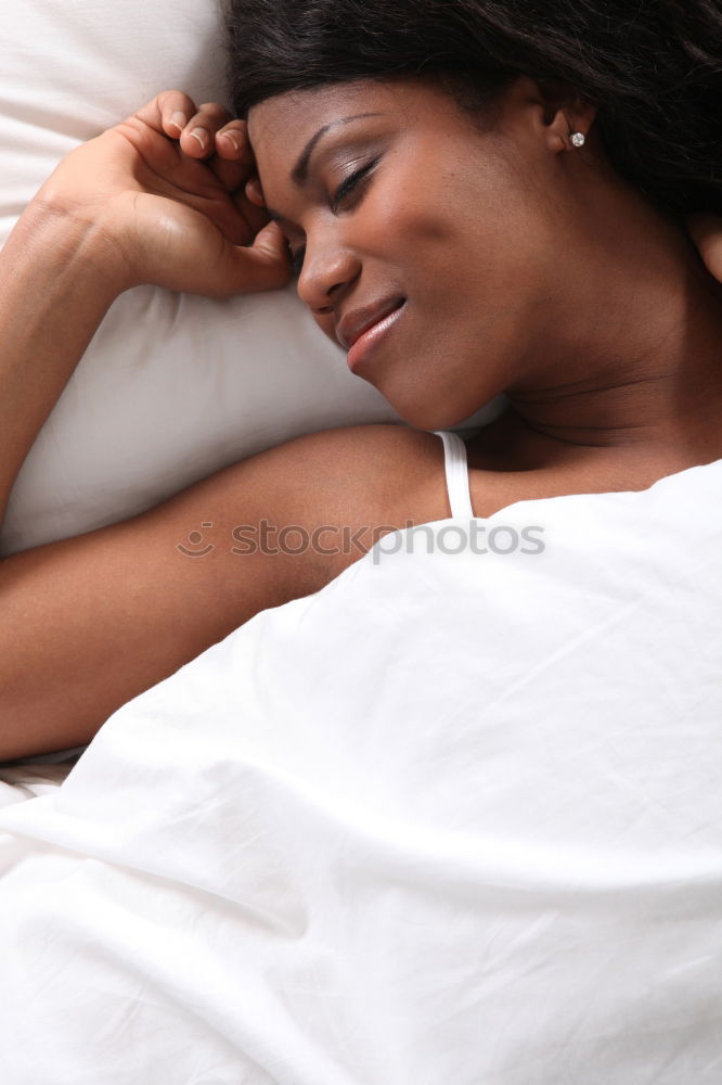 Similar – young dark skinned woman lies in lingerie on the bed and smiles into the camera