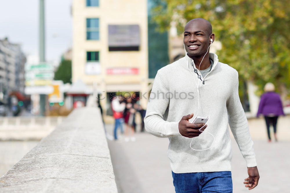 Similar – Image, Stock Photo Black young man with a smartphone in his hand