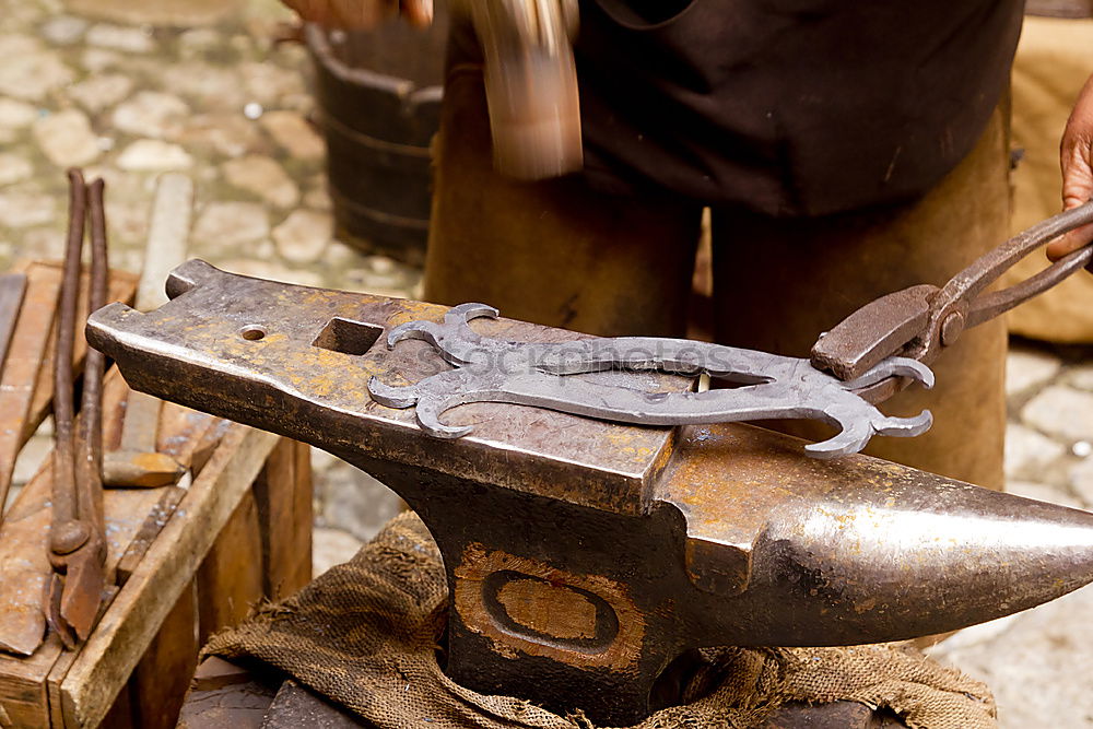 Similar – Image, Stock Photo Old hammer and anvil in a forge