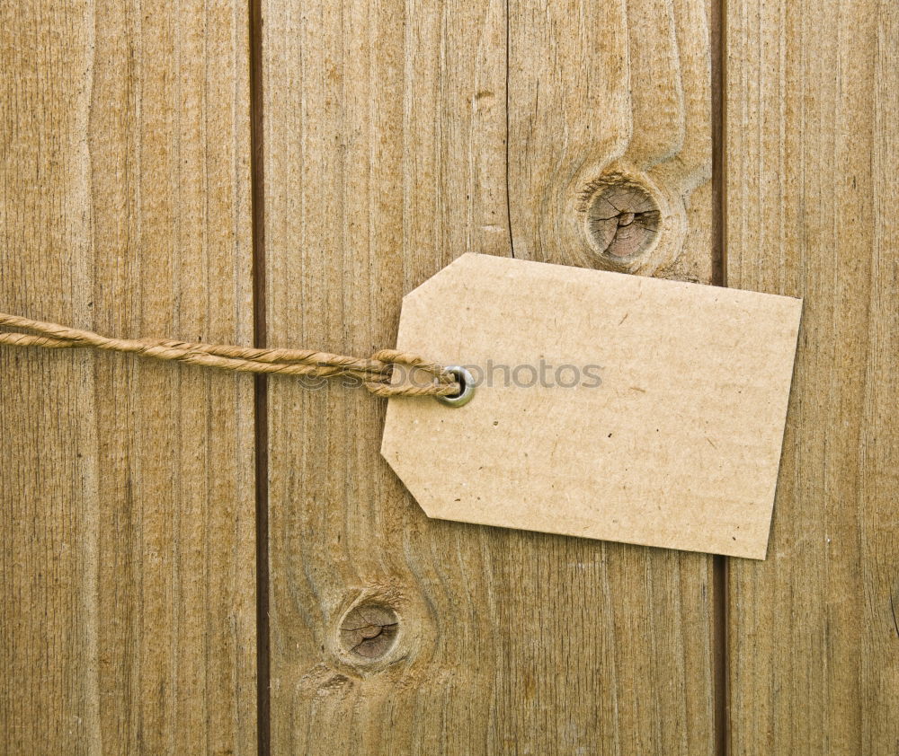 Similar – Image, Stock Photo Old rusty key with a paper label on the wooden board