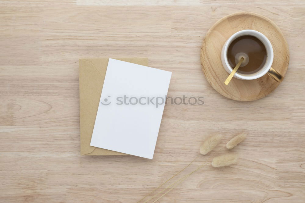 Similar – Green slip of paper with pen, a cup of coffee and a potted plant