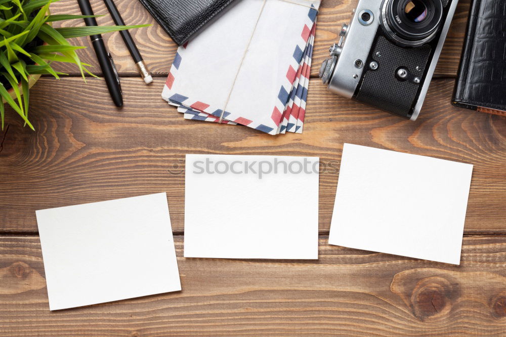 Similar – Green slip of paper with pen, a cup of coffee and a potted plant