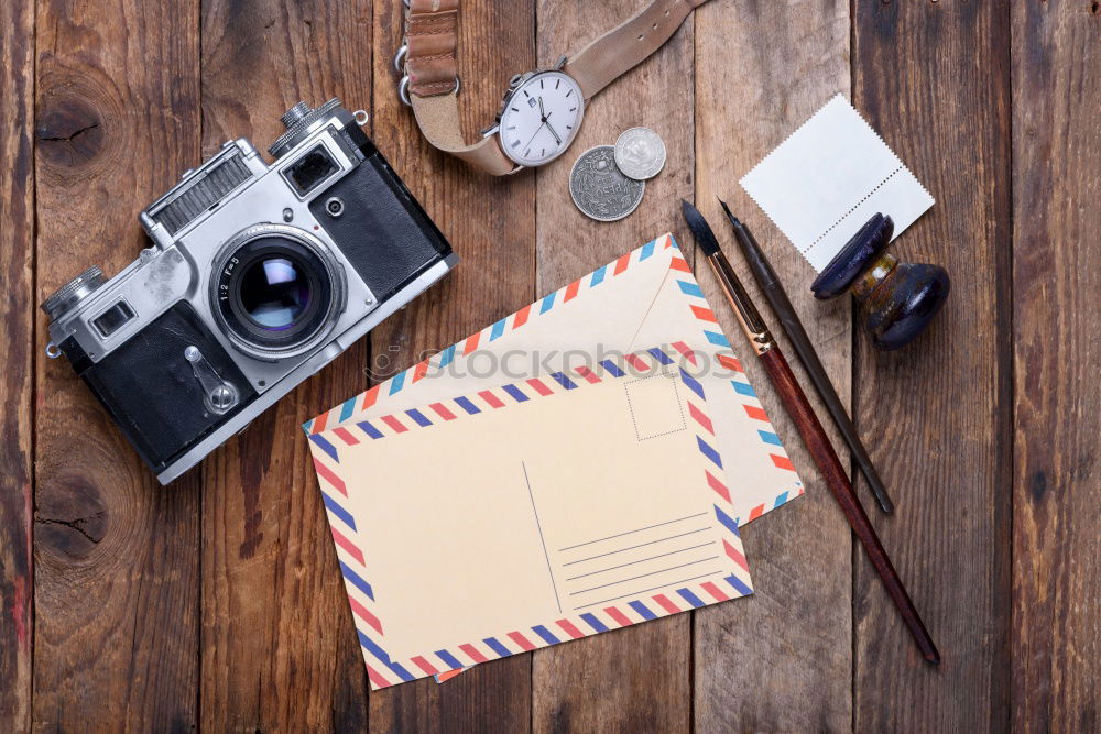 Similar – Camera, glasses and notepad on wood