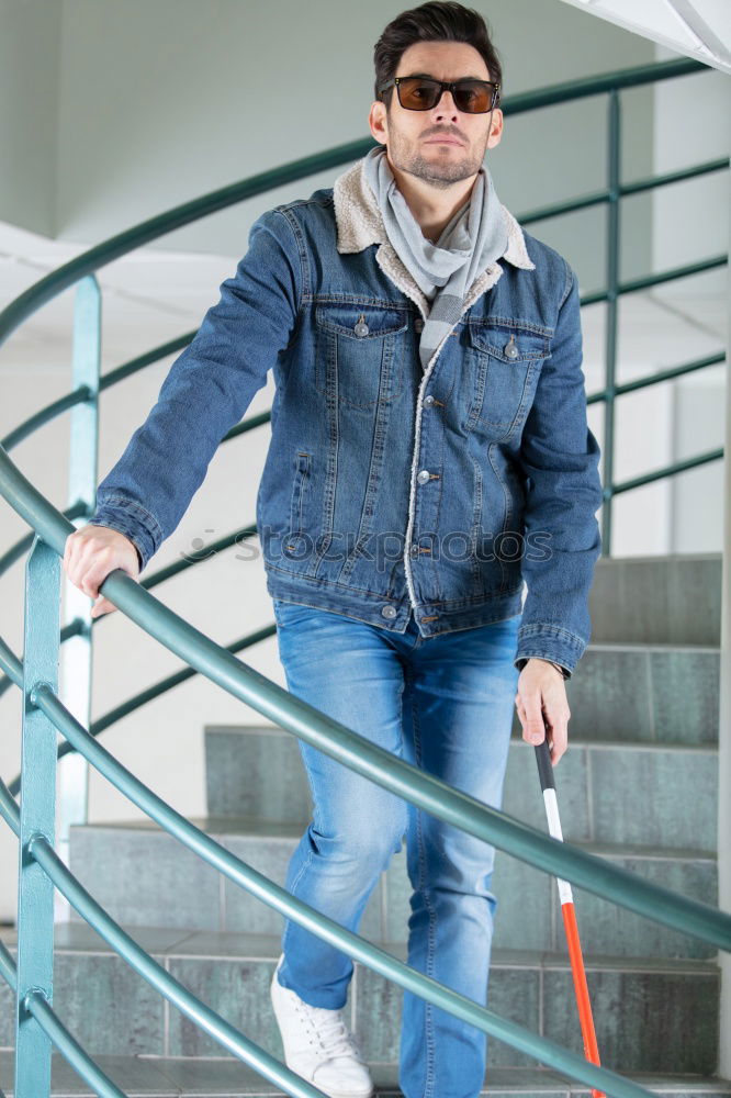 Similar – Portrait of a mature man sitting on steps in the street