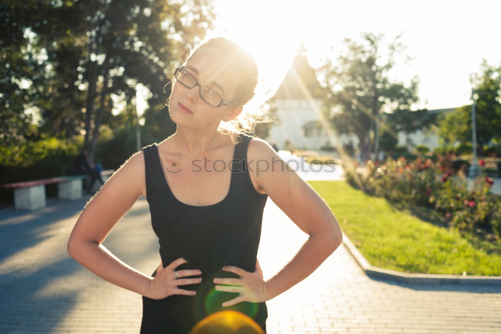 Similar – Image, Stock Photo Happy fit young woman does stretching workout on fitness mat practices yoga outside dressed in activewear has strong body breathes fresh air outdoor leads active lifestyle. Sport fitness concept