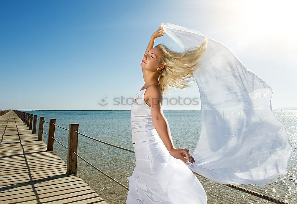 Similar – Image, Stock Photo Bride on the beach Wedding