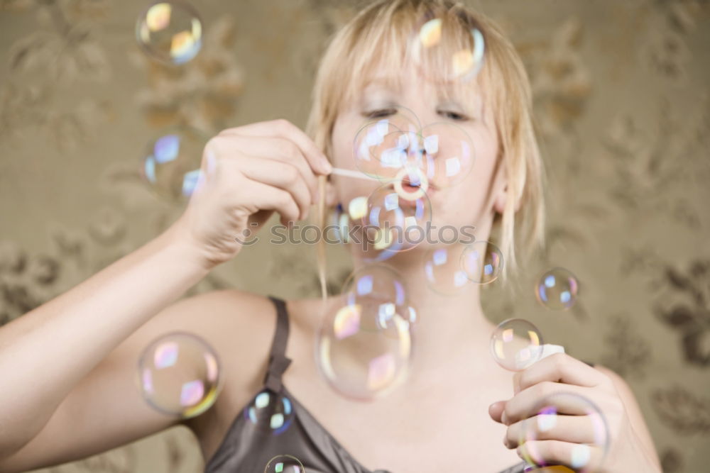 Similar – Thoughtful, dreamy, sweet girl with a white balloon in her hand in the garden, looks into the camera. Dear birthday girl outside in the nature is happy about a gift balloon for her party, holds it tight and puts it in her mouth.