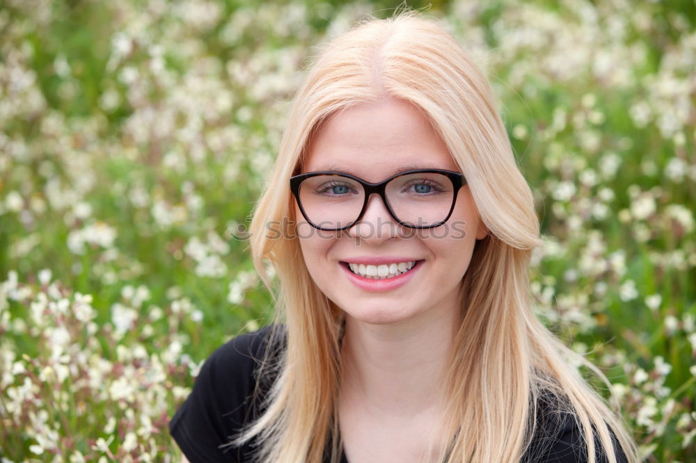 Similar – young blonde woman with ponytail and glasses