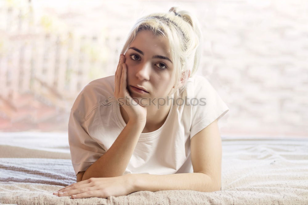 Similar – Young woman lying in bed