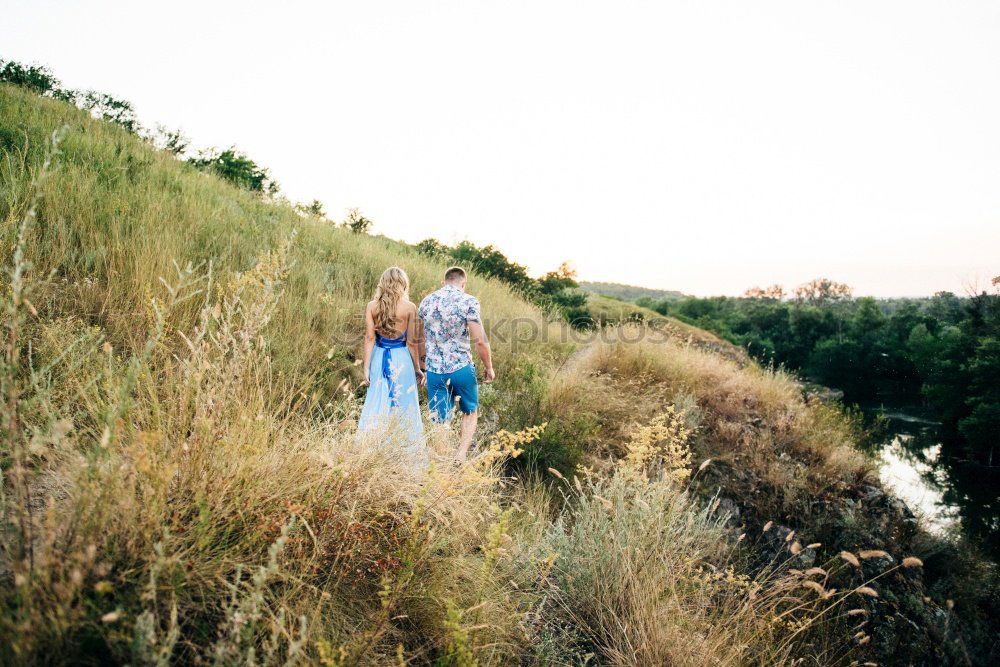 Similar – Couple of young people standing and held hands