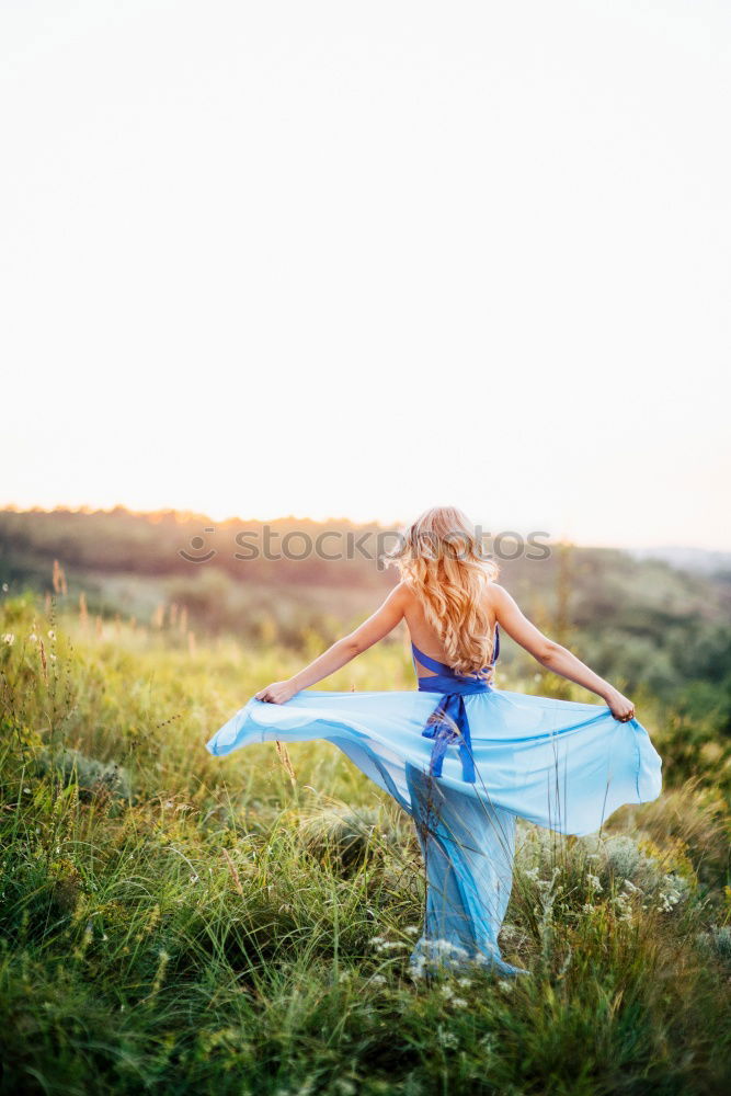 Similar – Young woman leaning on bridge railing