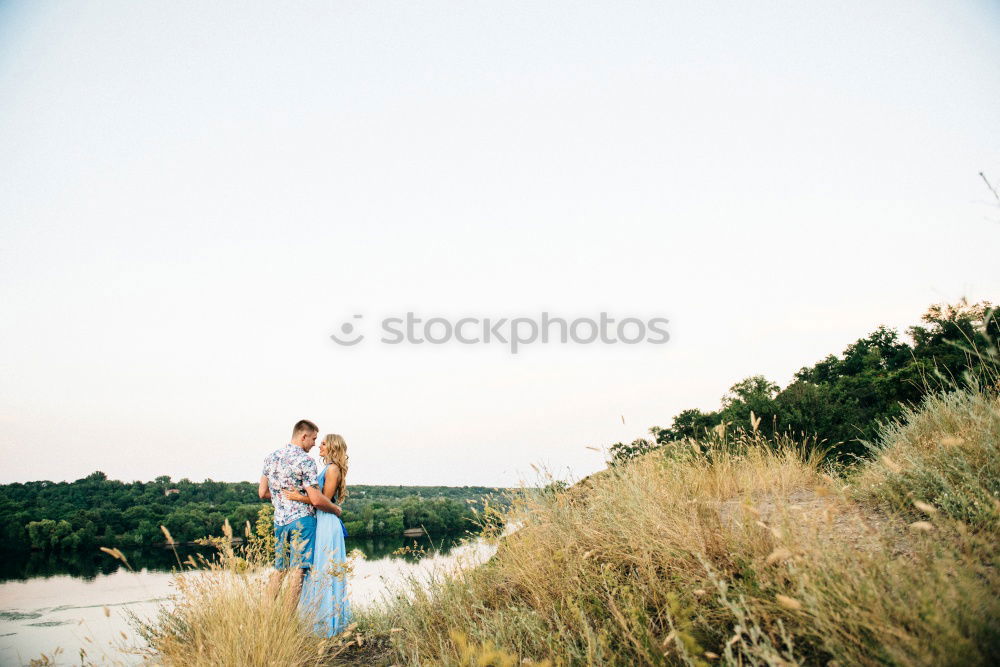 Similar – Couple of young people standing and held hands