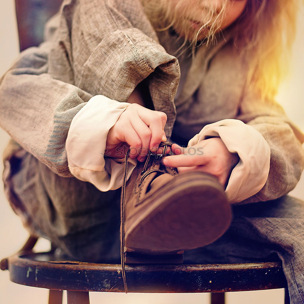 Young FRau sits laughing on the floor