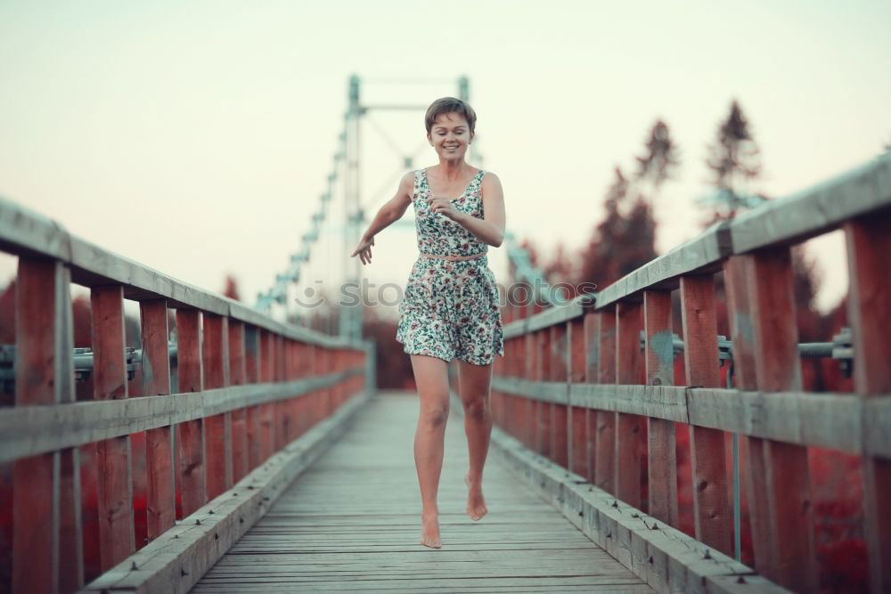 Similar – Image, Stock Photo Smiling blonde girl wearing dress dancing outdoors.