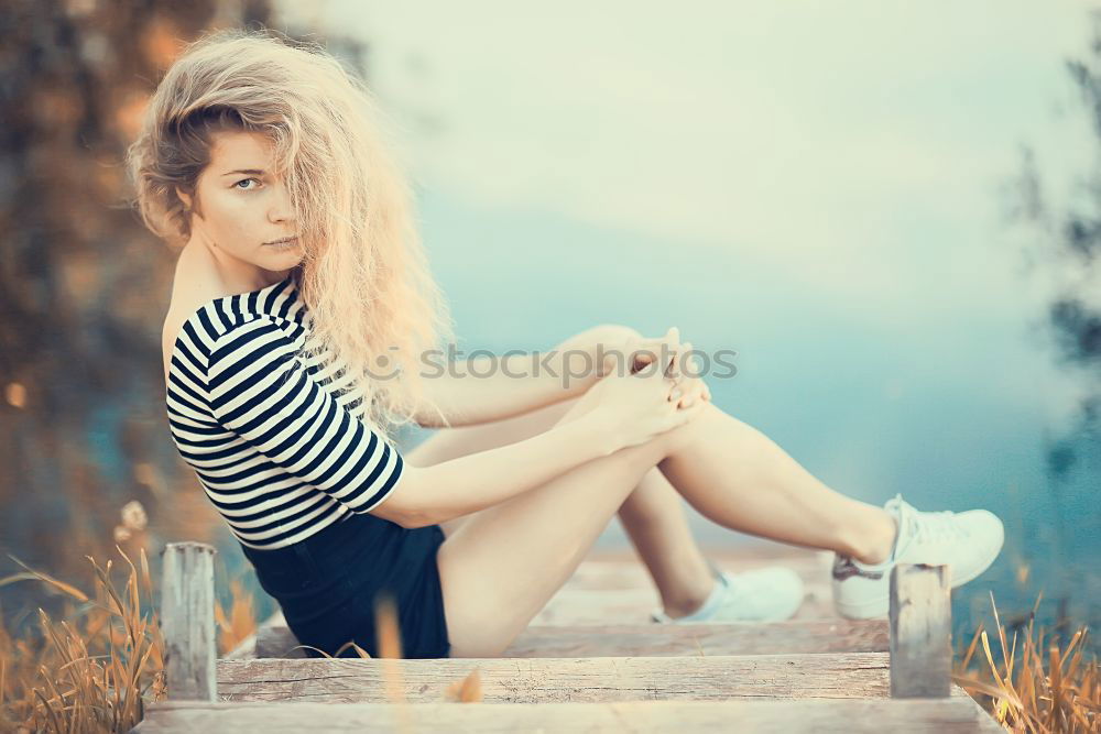 Similar – Image, Stock Photo Happy woman sitting on urban background sunbathing