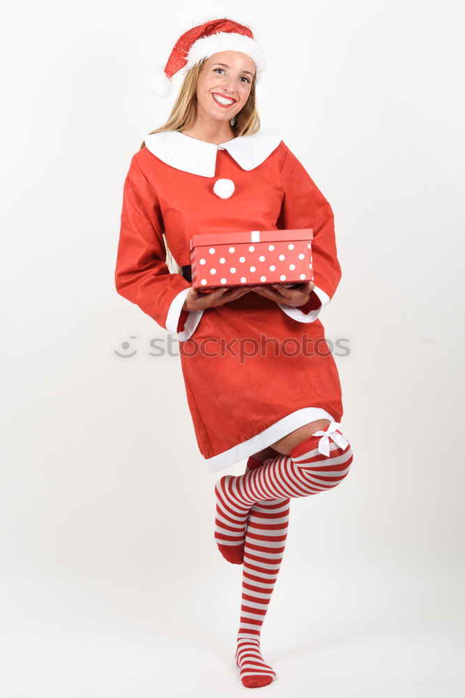 Similar – Image, Stock Photo Girl standing by Christmas gift put near tree