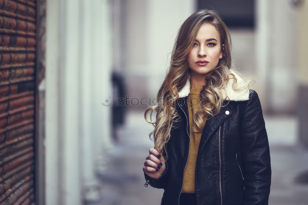 Similar – Woman in Winter Outfit in Front Old Gray Wall