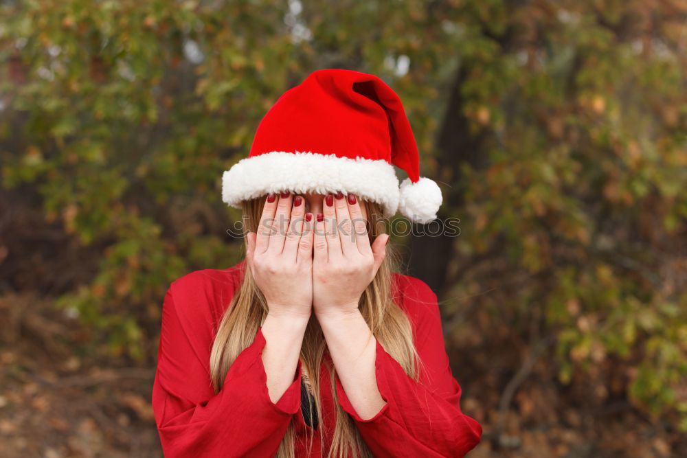 Similar – Image, Stock Photo Young woman with Christmas hat in the forest