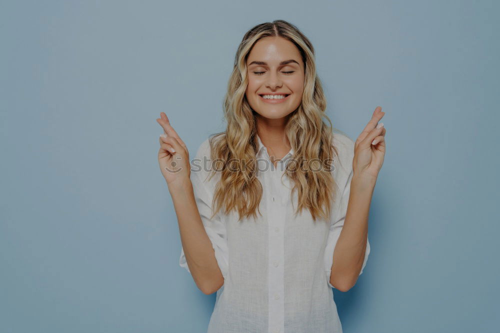 Similar – Image, Stock Photo Happy woman sitting outdoors putting her hand near the camera.