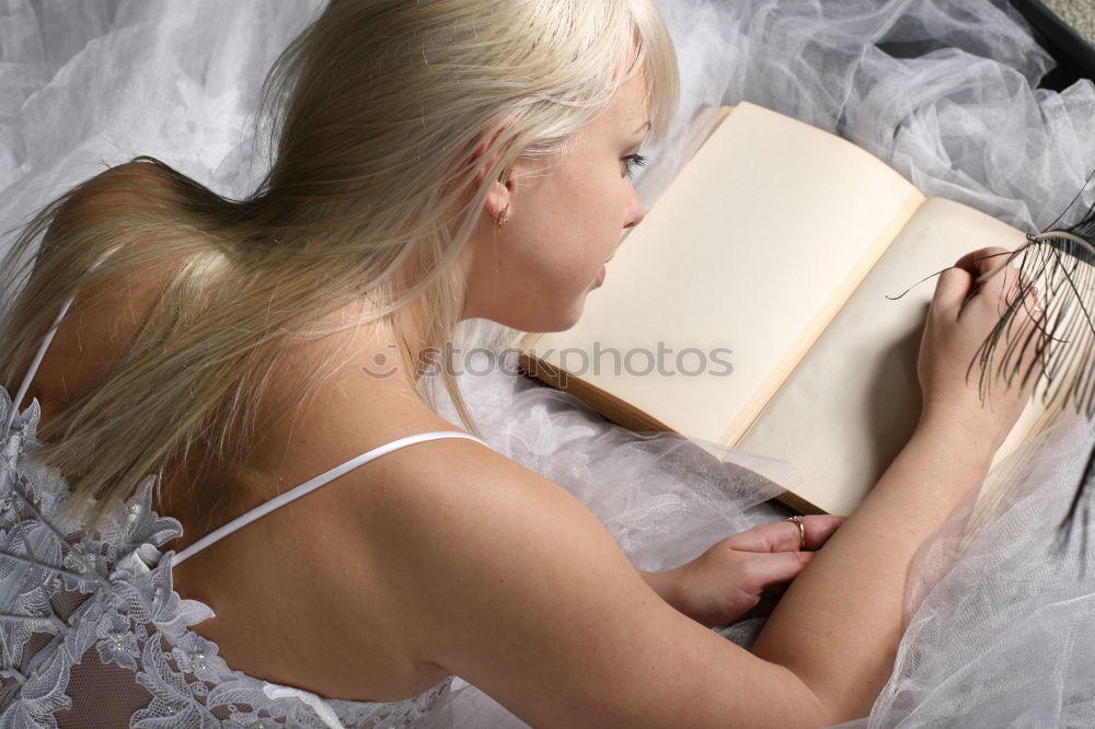 Similar – Young woman reading in her room