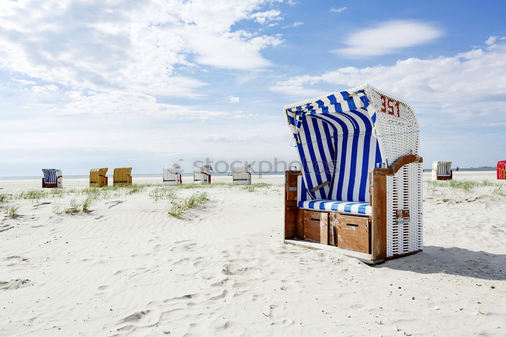 Similar – Strandkörbe auf dem Sand an der Nordsee auf der Insel Sylt. Sommerurlaub