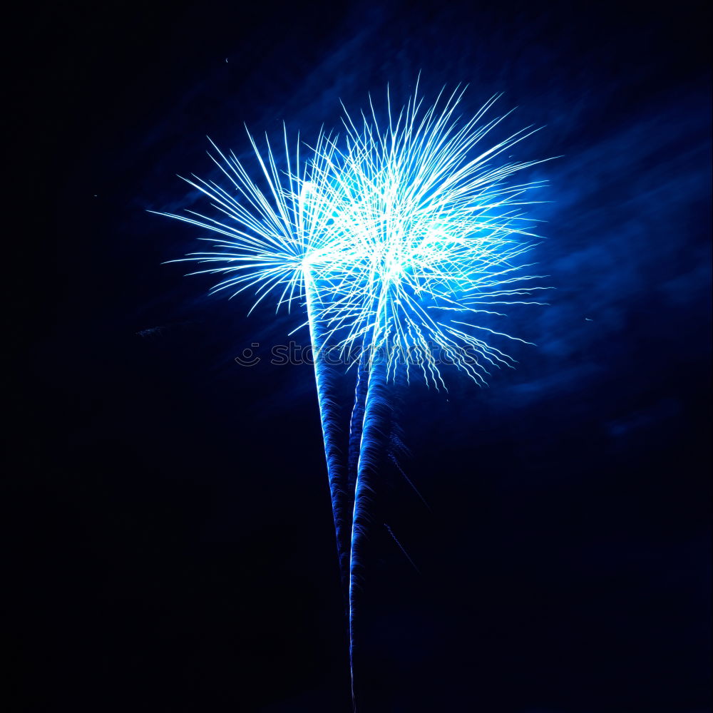 Similar – Blue fireworks with water reflection