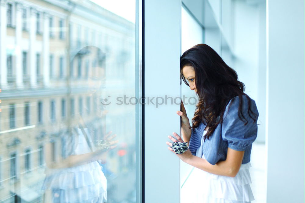 Similar – Image, Stock Photo Young beautiful woman reflected in a huge window