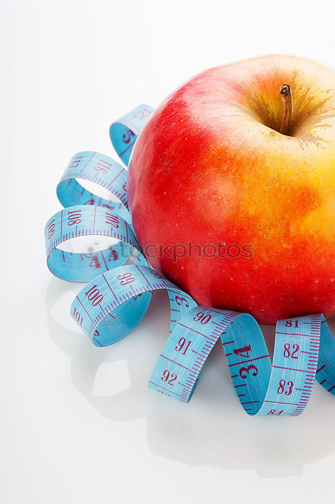 Similar – Red apple with a tape measure