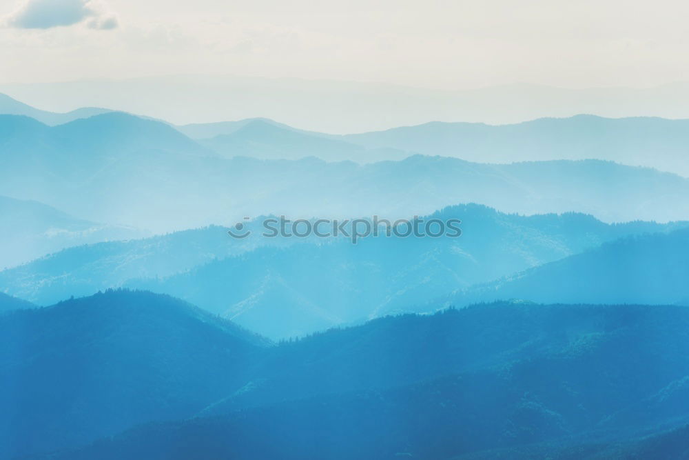 Similar – Landscape with blue mountains