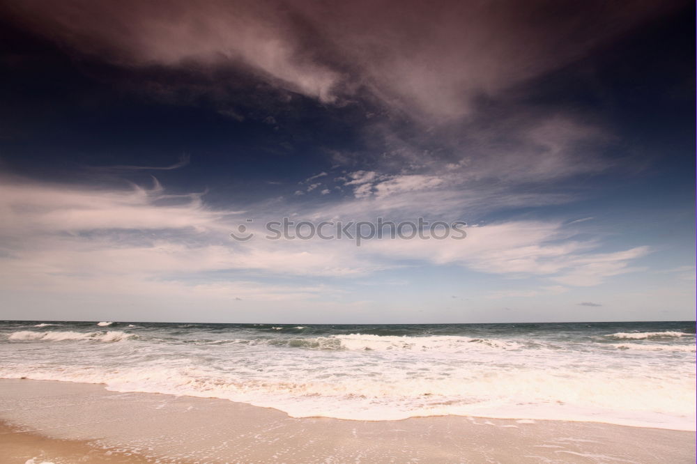 Similar – Image, Stock Photo Sand, sea and blue sky and dark clouds. At the beach of Fraser Island at the east coast of Queensland / Australia