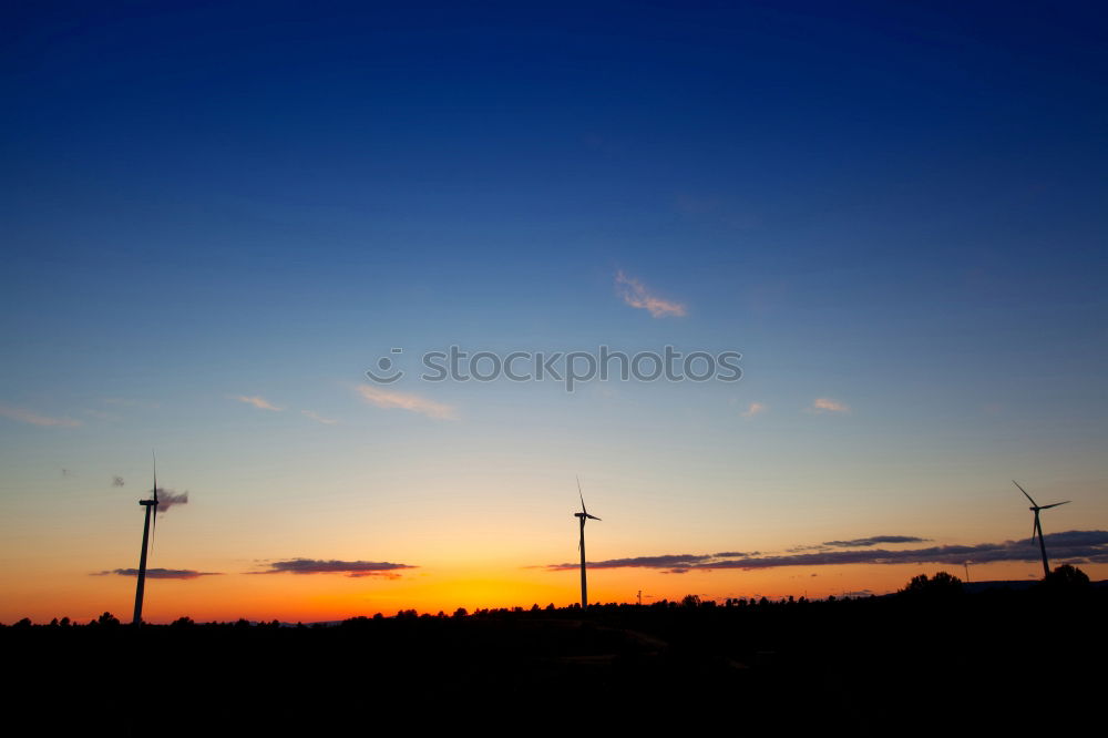 Similar – Windmills at sunset