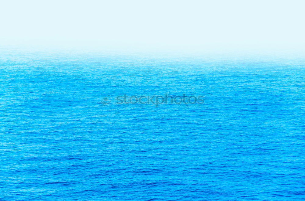 Similar – Blue ocean background with blue sky