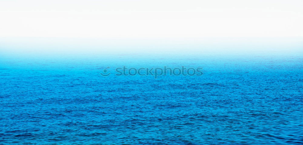 Similar – Blue ocean background with blue sky