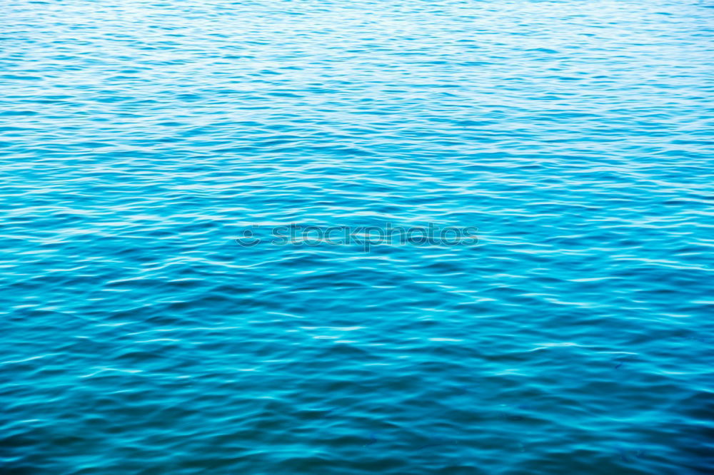 Similar – Blue ocean background with blue sky