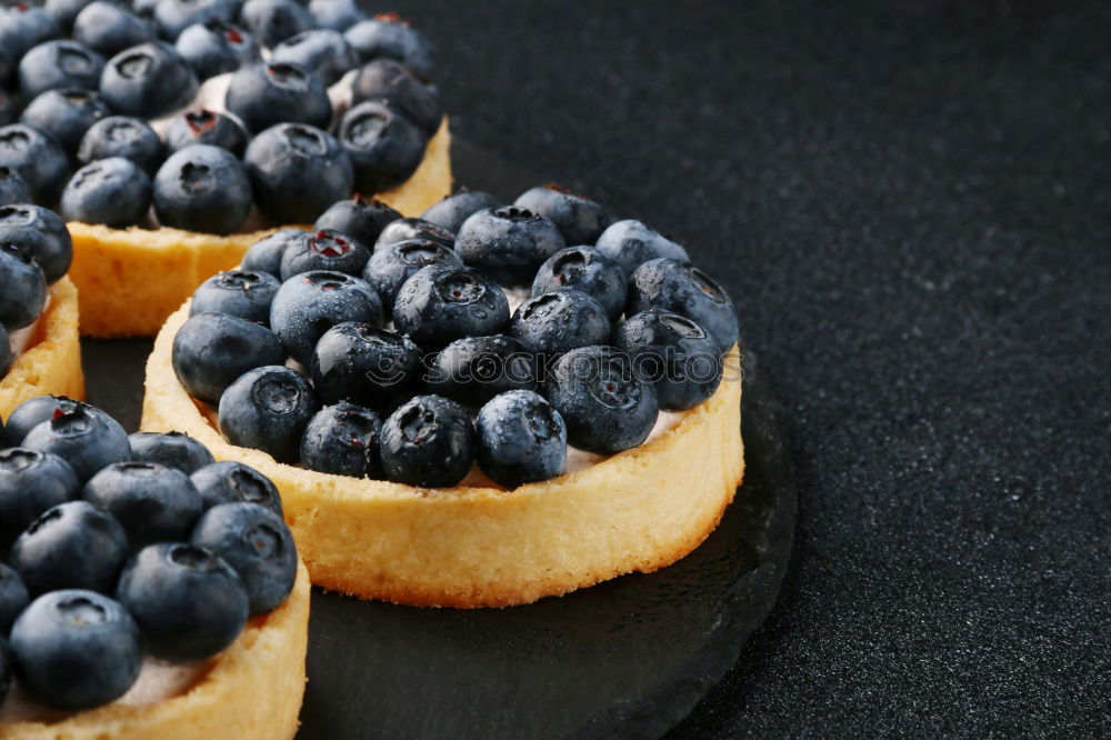 Similar – Delicious tartlets with raspberries and blueberries