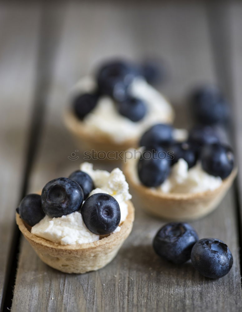 Similar – Image, Stock Photo Delicious tartlets with raspberries and blueberries