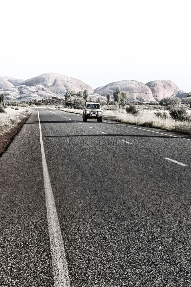 Similar – Image, Stock Photo After the bend, straight ahead…road in the Outback Northern Territory. Australia which runs endlessly straight.