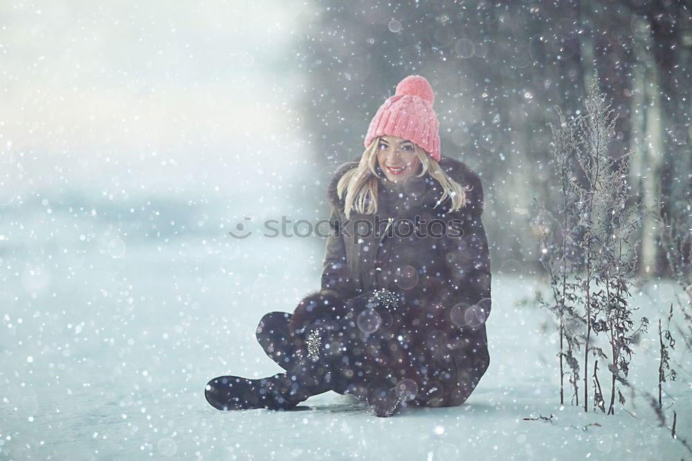 Similar – Young blonde woman lost in a snowy forest