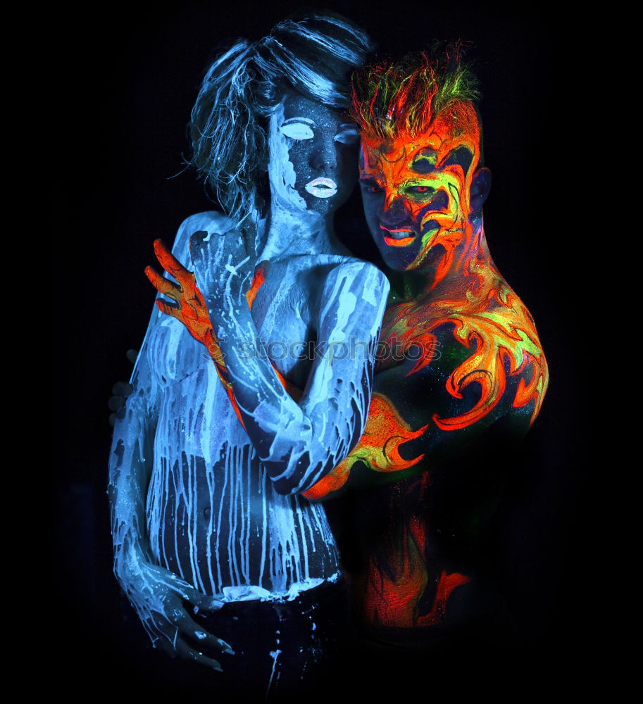 Similar – Image, Stock Photo Two woman disguised as devils in the dark