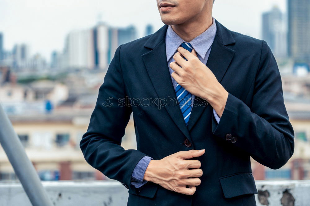 Similar – Image, Stock Photo Elegant Young Businessman in the Street Using a Mobile Phone