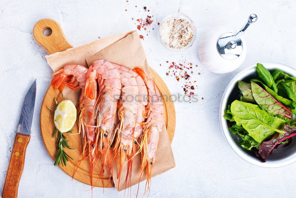 Similar – Salmon with spinach on a white kitchen table