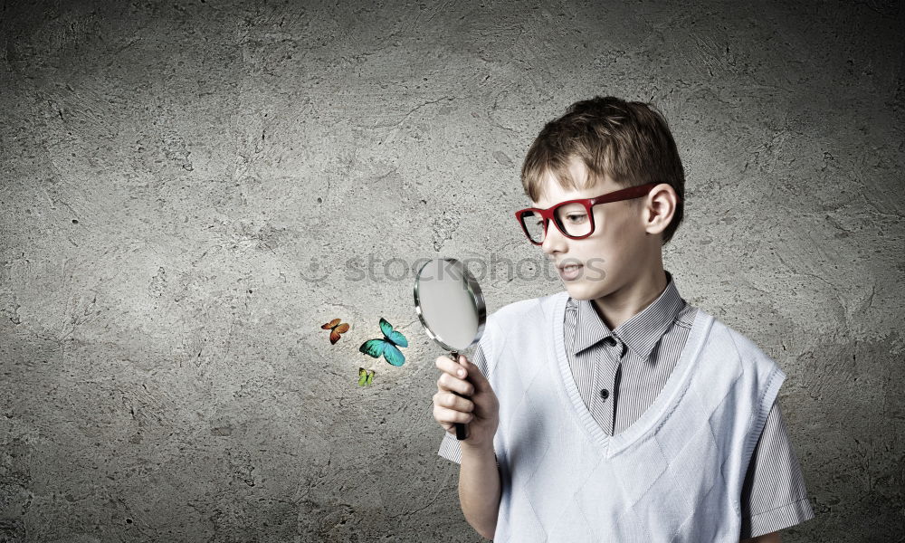 Similar – Image, Stock Photo One little boy reading to robot from cardboard boxes outdoors. Concept of science and education.