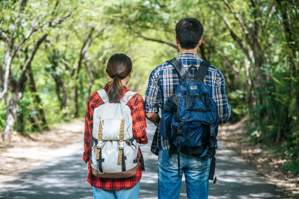 Similar – Image, Stock Photo Couple of hikers doing trekking