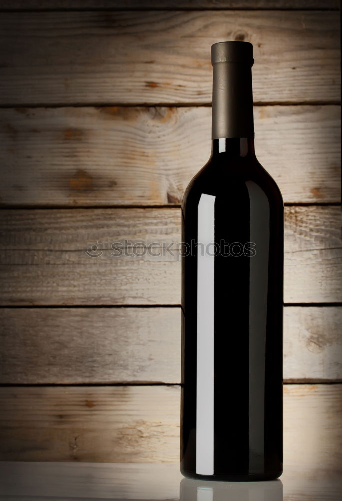 Similar – Red wine bottle and red wine glass with grapes