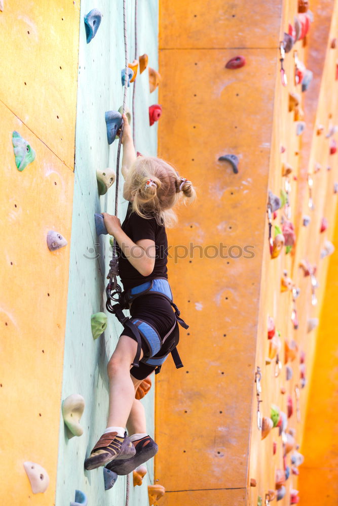 Similar – Image, Stock Photo little girl climbing a rock wall outdoor. Concept of sport life.