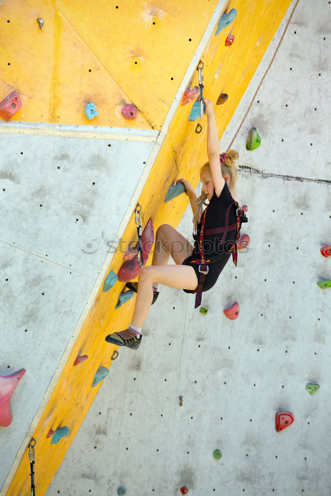 Similar – Image, Stock Photo little girl climbing a rock wall outdoor. Concept of sport life.