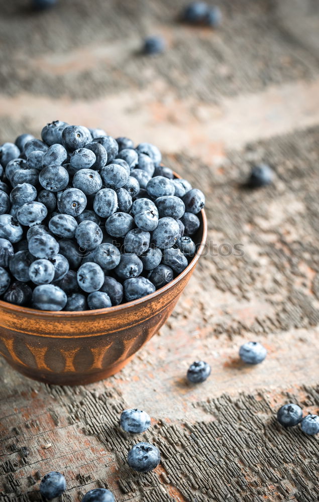 Similar – Image, Stock Photo Freshly gathered blueberries put into ceramic bowl