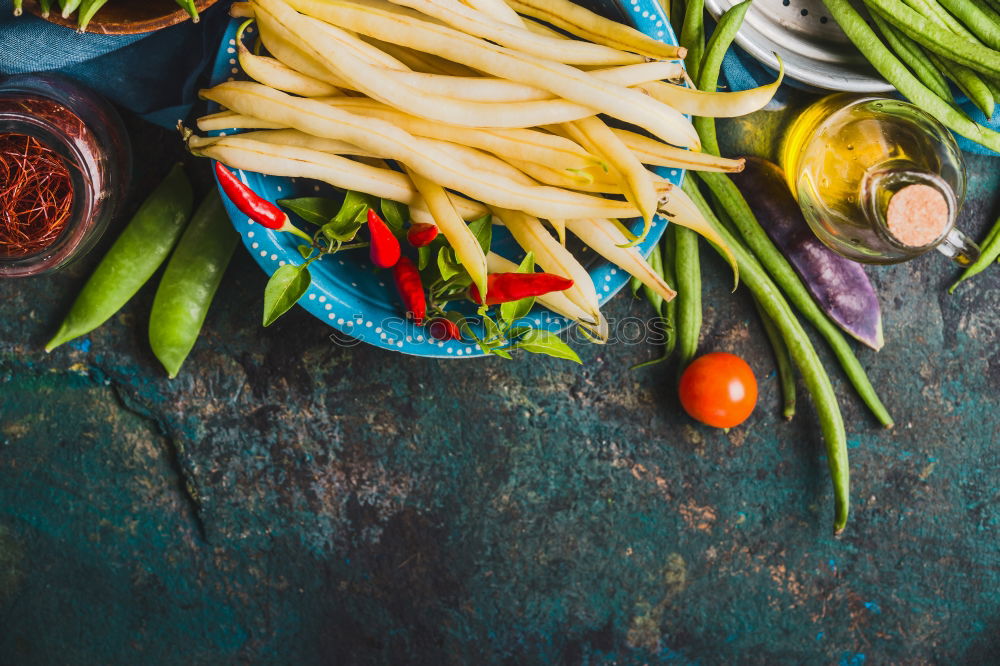 Similar – Image, Stock Photo Colorful tomatoes on the kitchen table with basil